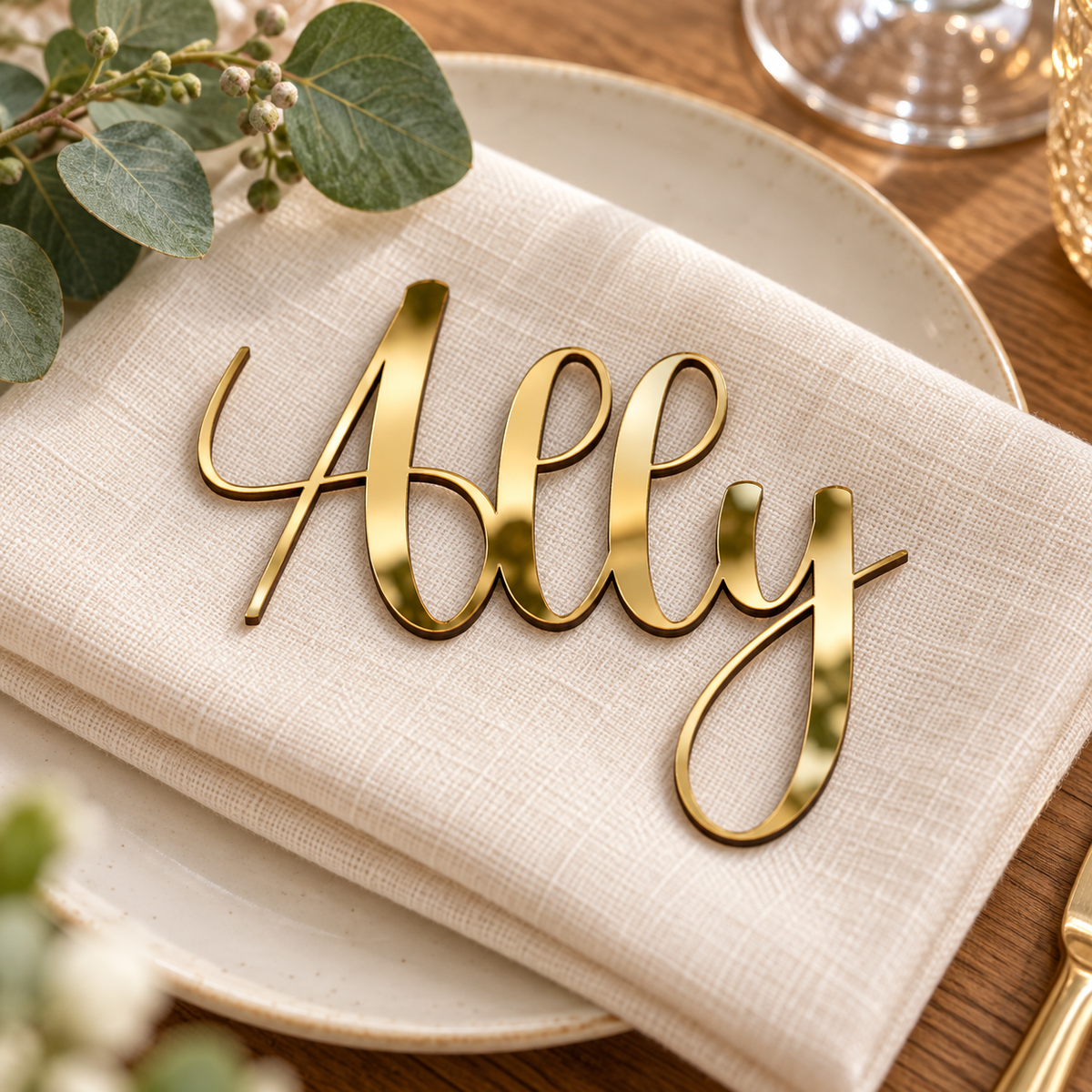 Ally in Anytimes font, Mirror Gold Acrylic personalised guest name on an ivory napkin.