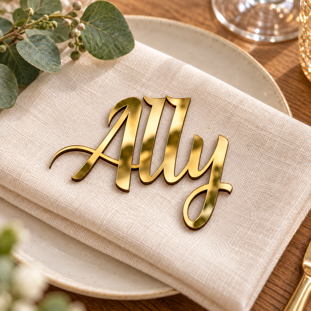 Ally in Eaglese Pro font, Mirror Gold Acrylic personalised guest name on an ivory napkin.