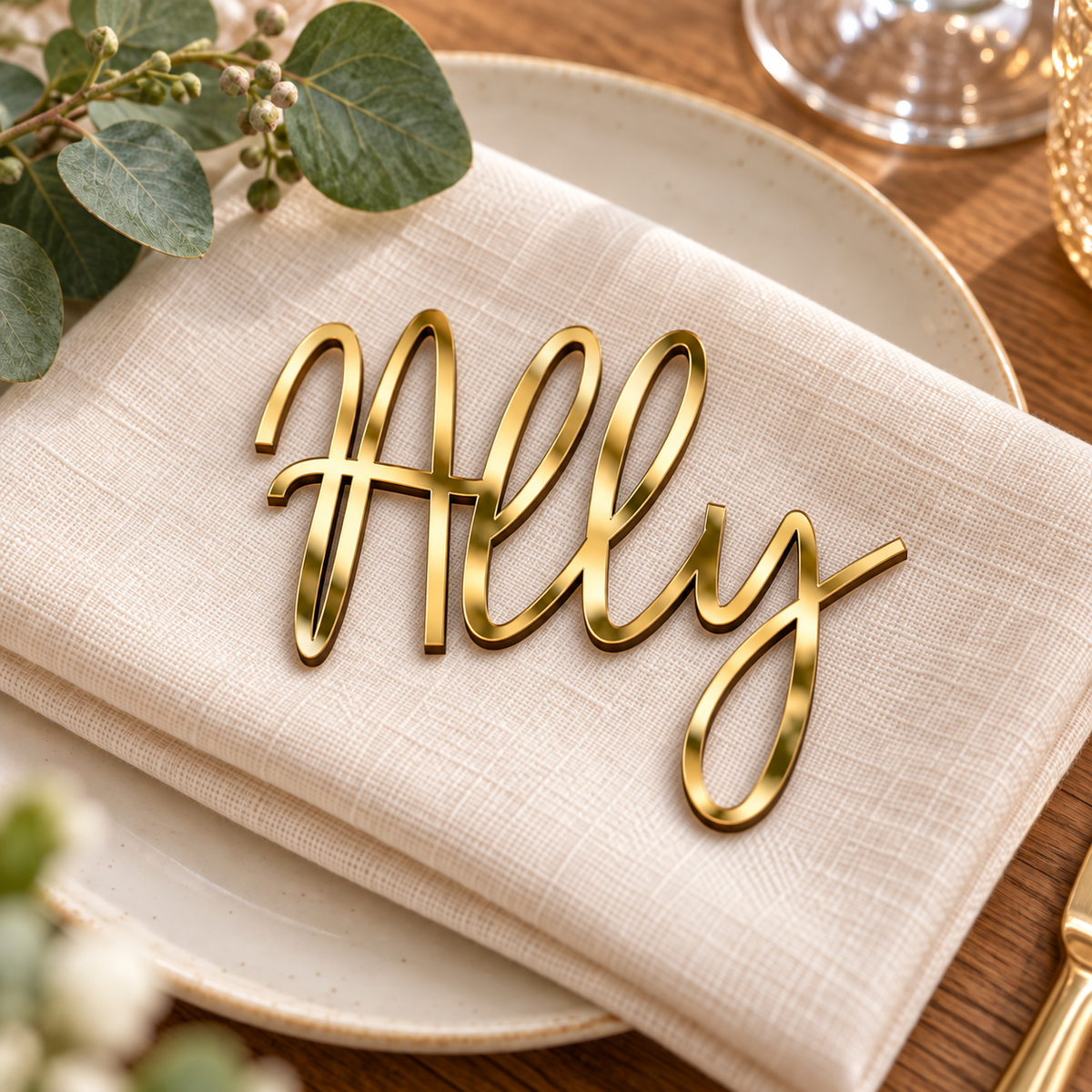 Ally in Framhouse font, Mirror Gold Acrylic personalised guest name on an ivory napkin.