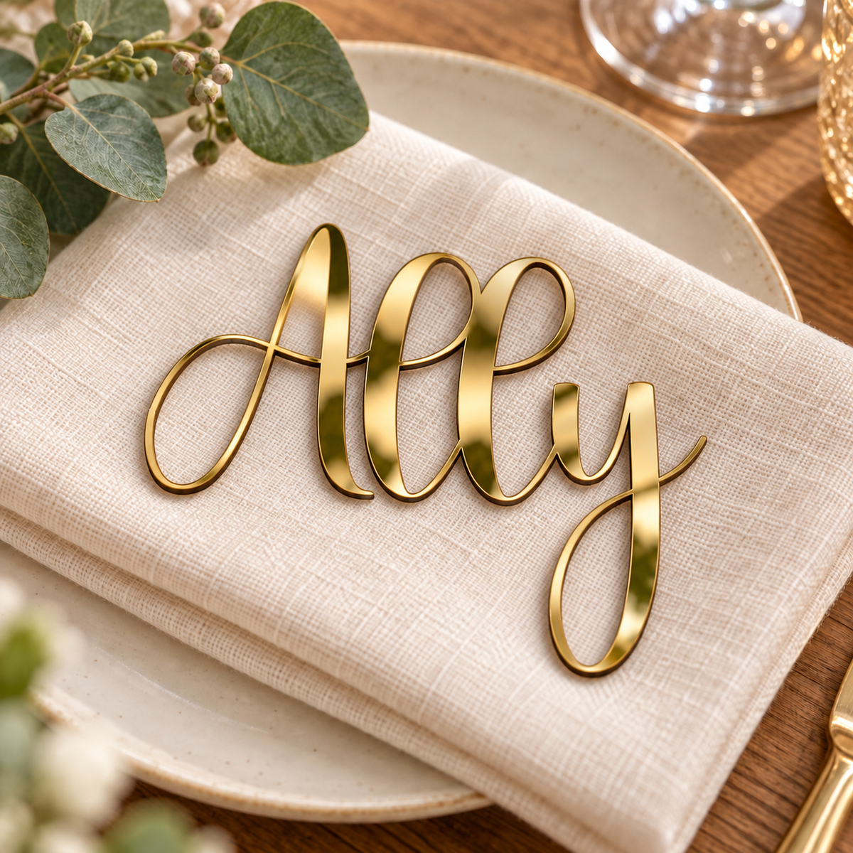 Ally in Highbright font, Mirror Gold Acrylic personalised guest name on an ivory napkin.