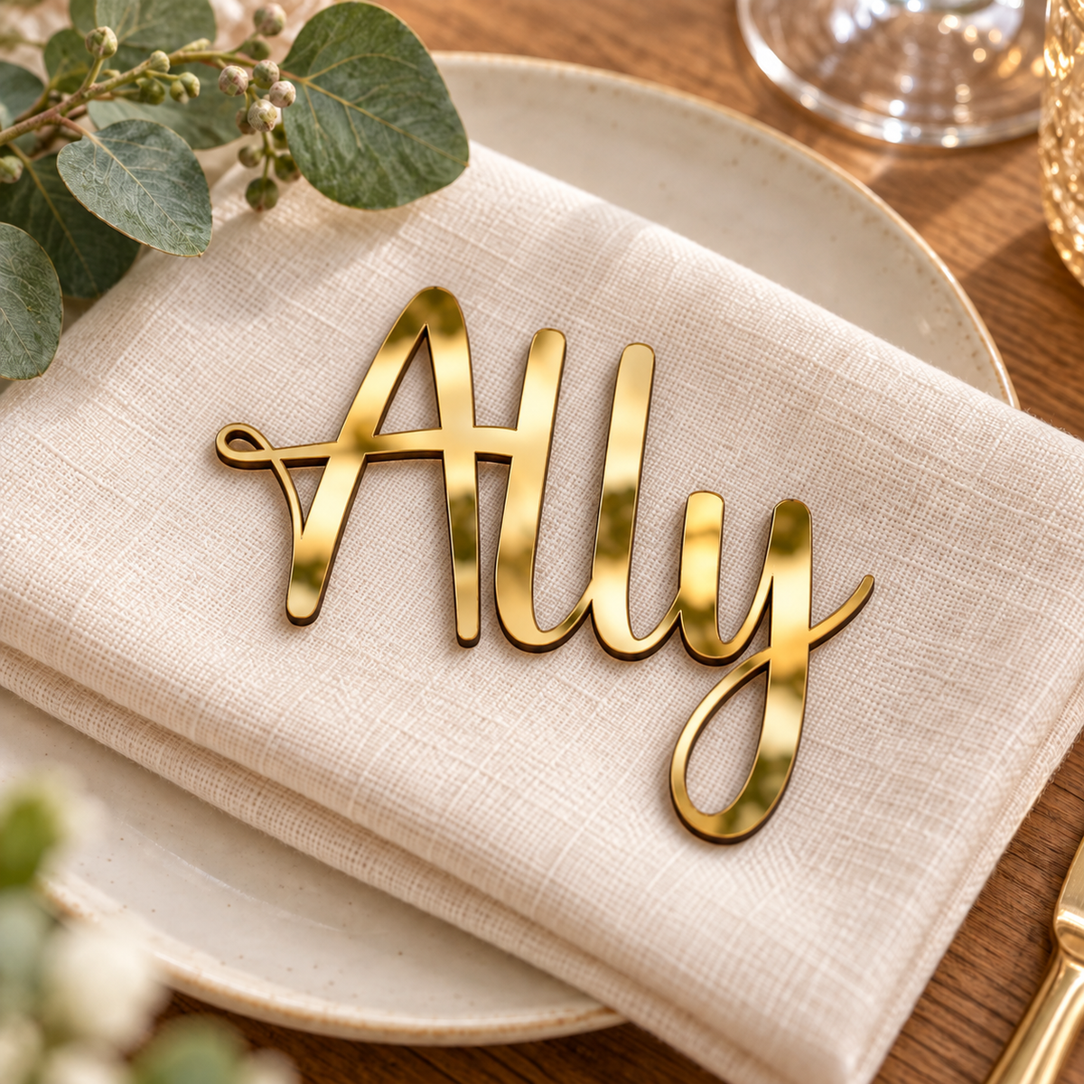 Ally in Lucky font, Mirror Gold Acrylic personalised guest name on an ivory napkin.