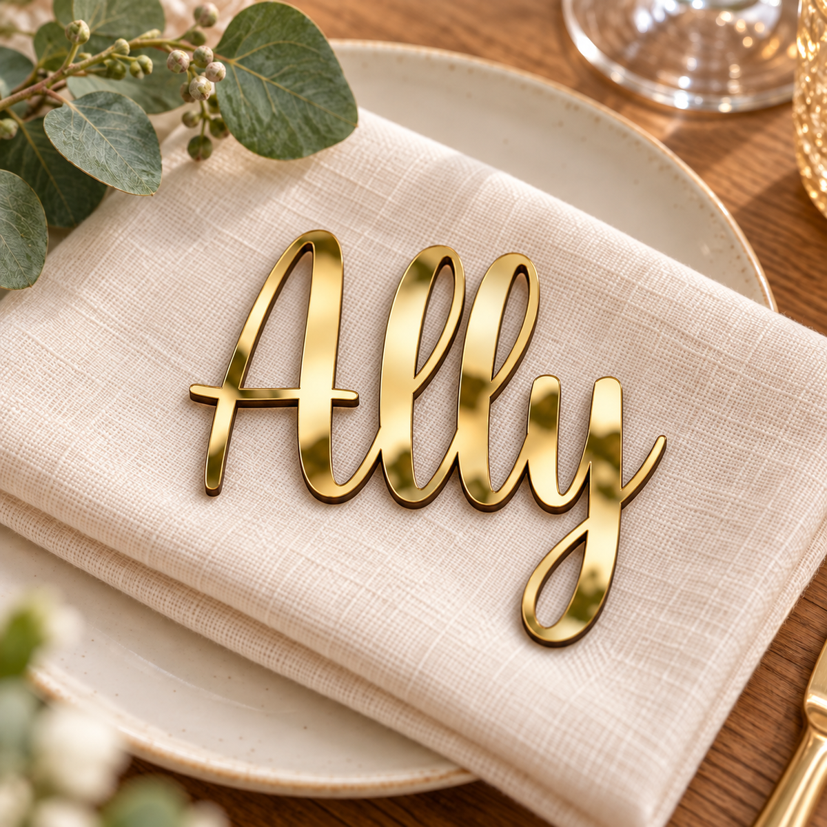 Ally in Relaytemore font, Mirror Gold Acrylic personalised guest name on an ivory napkin.