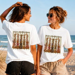 A Girl's Gotta Have Options - Women's T-Shirt in white, showing alternative back and front print placements on the beach