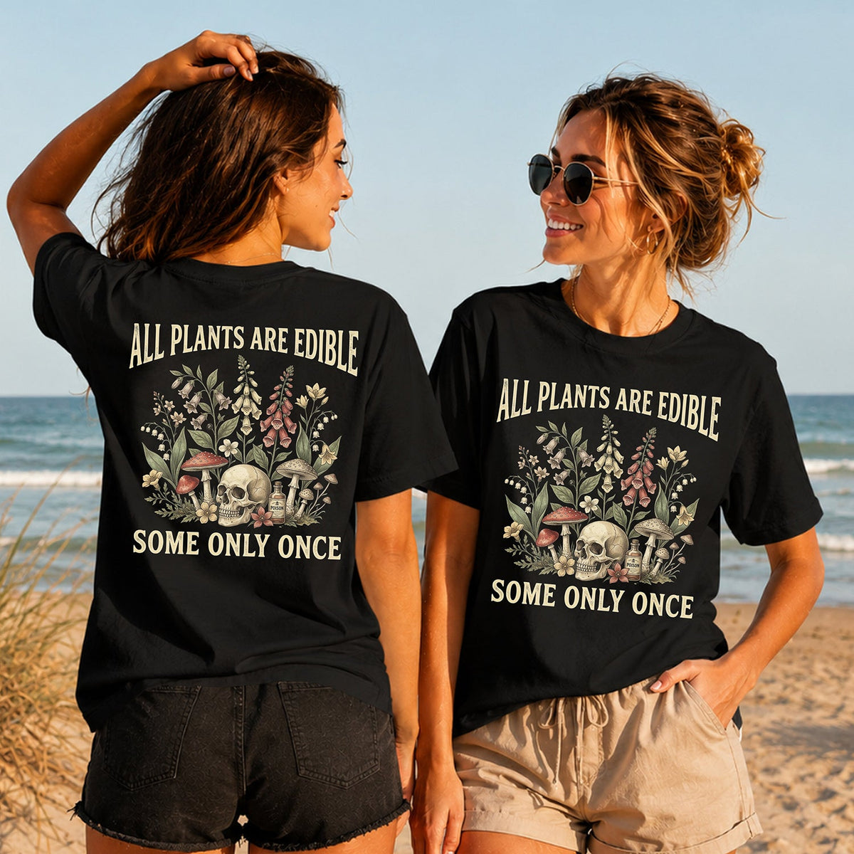 All Plants Are Edible - Women's T-Shirt in black, showing alternative back and front print placements on the beach