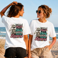 Am I Okay - Colourful Skeleton - Women's T-Shirt in white, showing alternative back and front print placements on the beach