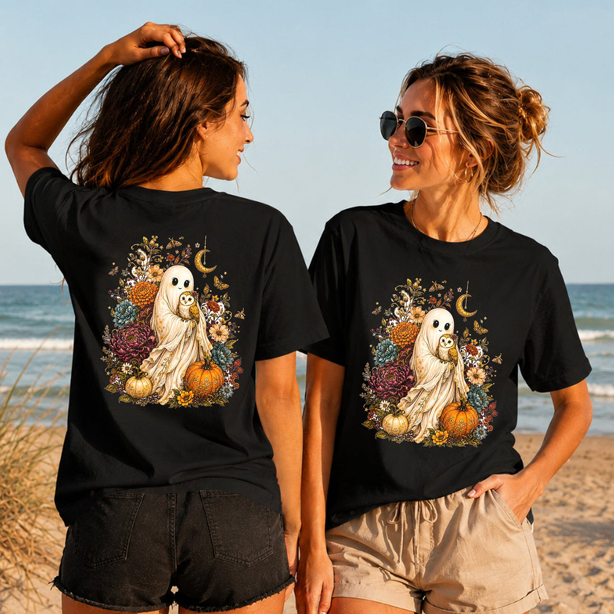 Boho Ghost and Owl - Women's T-Shirt in black, showing alternative back and front print placements on the beach