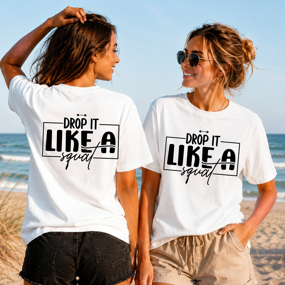 Drop It Like a Squat - Block - Women's T-Shirt in white, showing alternative back and front print placements on the beach