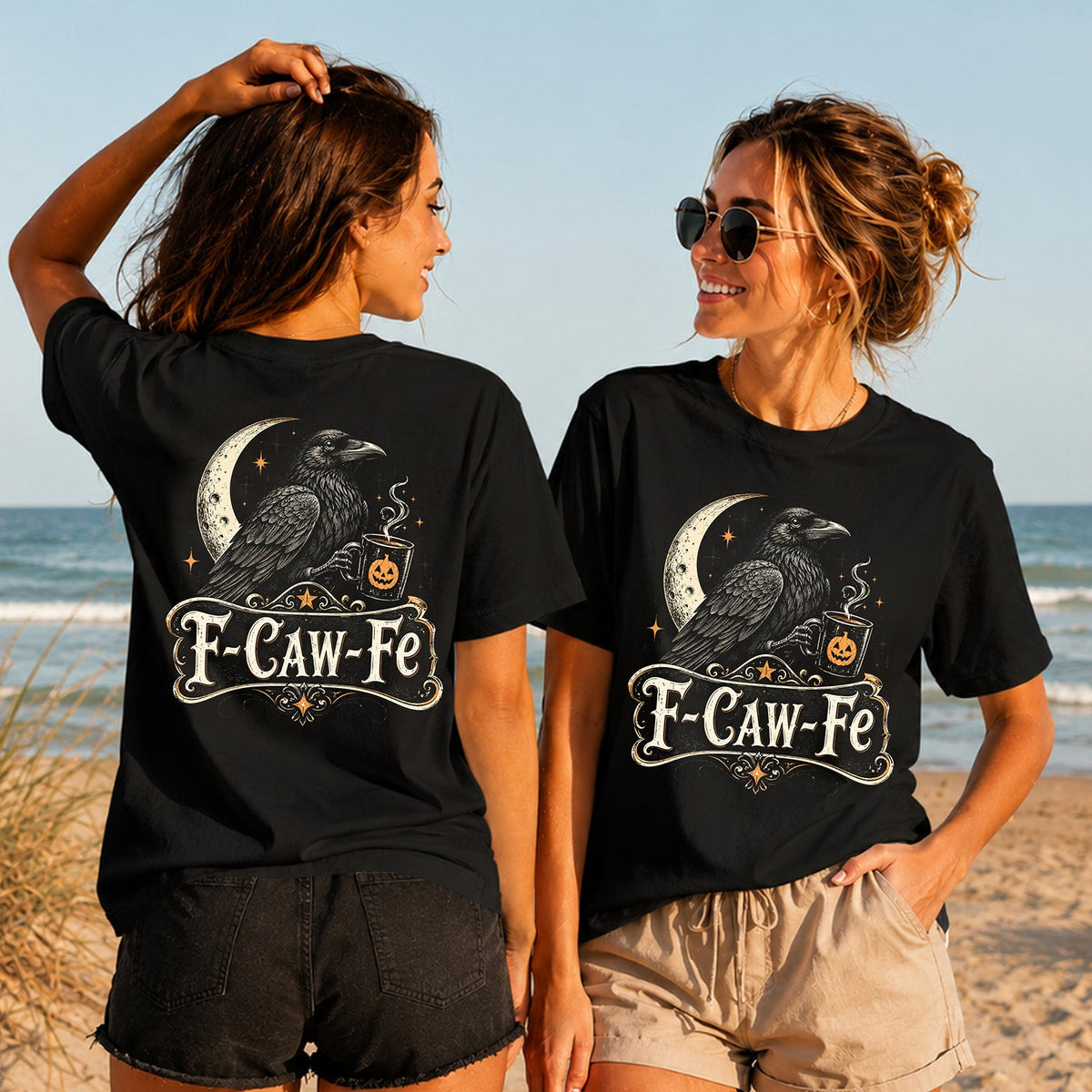 F-Caw-Fe Raven - Women's T-Shirt in black, showing alternative back and front print placements on the beach