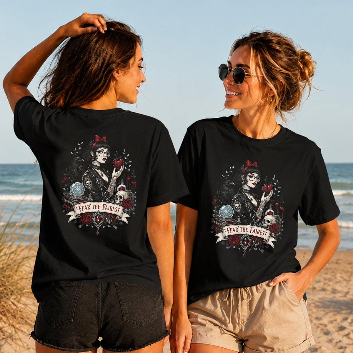 Fear the Fairest - Women's T-Shirt in black, showing alternative back and front print placements on the beach