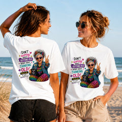 Good Vibes Never Get Old - Women's T-Shirt in white, showing alternative back and front print placements on the beach