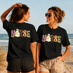Halloween Nurse Lettering - Women's T-Shirt in black, showing alternative back and front print placements on the beach