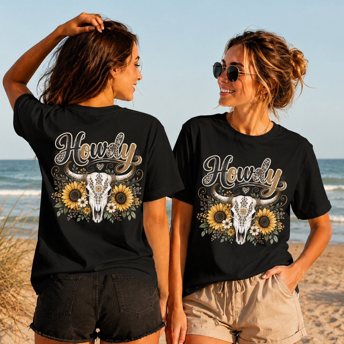 Howdy Sunflower Skull - Women's T-Shirt in black, showing alternative back and front print placements on the beach