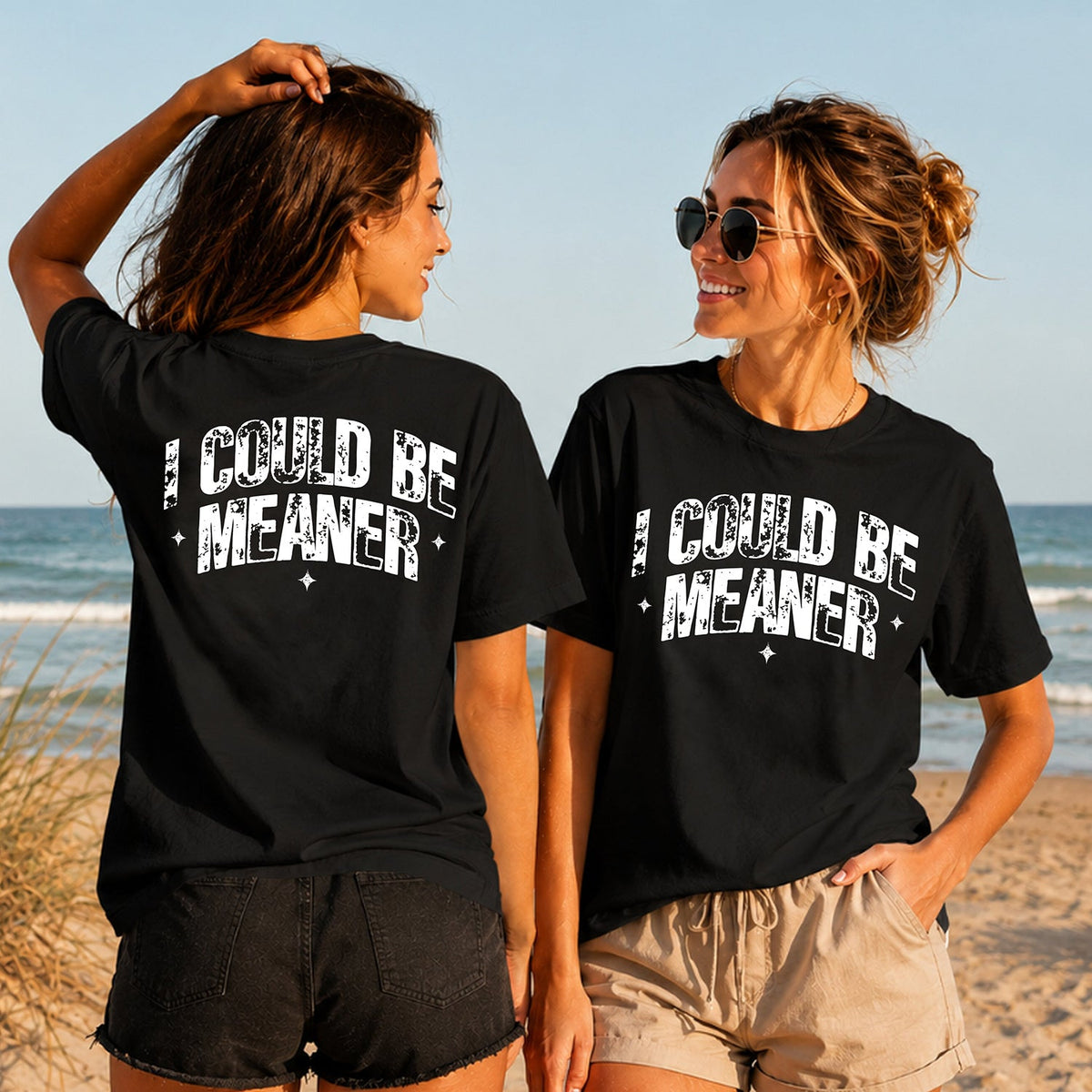 I Could Be Meaner - White Lettering - Women's T-Shirt in black, showing alternative back and front print placements on the beach