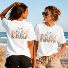 Just Pray Floral - Women's T-Shirt in white, showing alternative back and front print placements on the beach