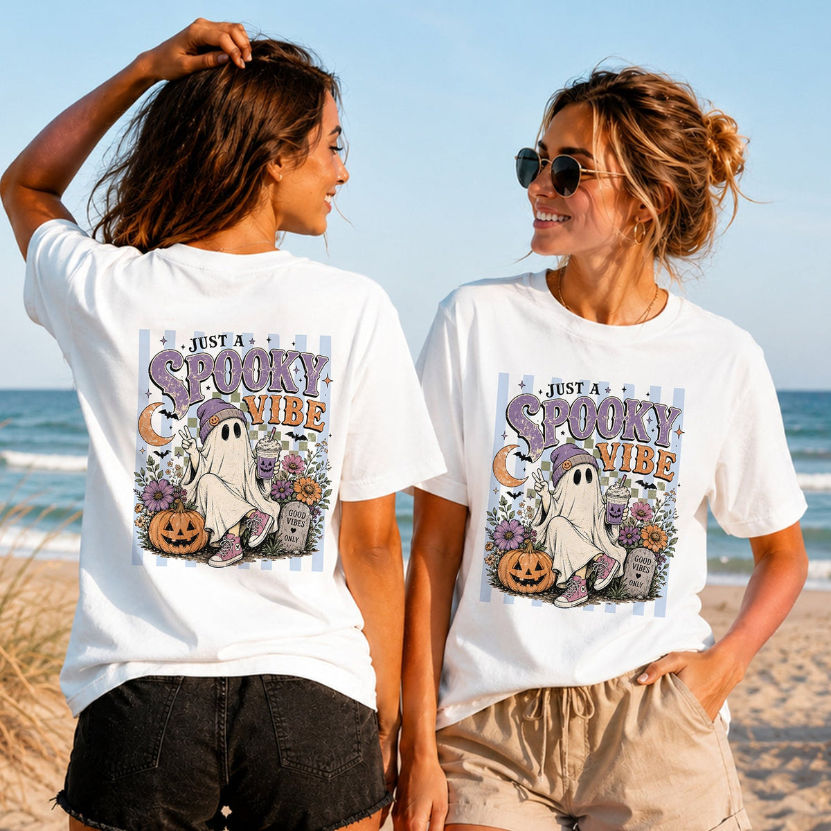Just a Spooky Vibe - Women's T-Shirt in white, showing alternative back and front print placements on the beach