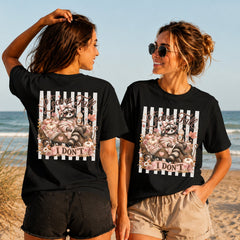 Leaves Fall I Don't - Glam Raccoon - Women's T-Shirt in black, showing alternative back and front print placements on the beach