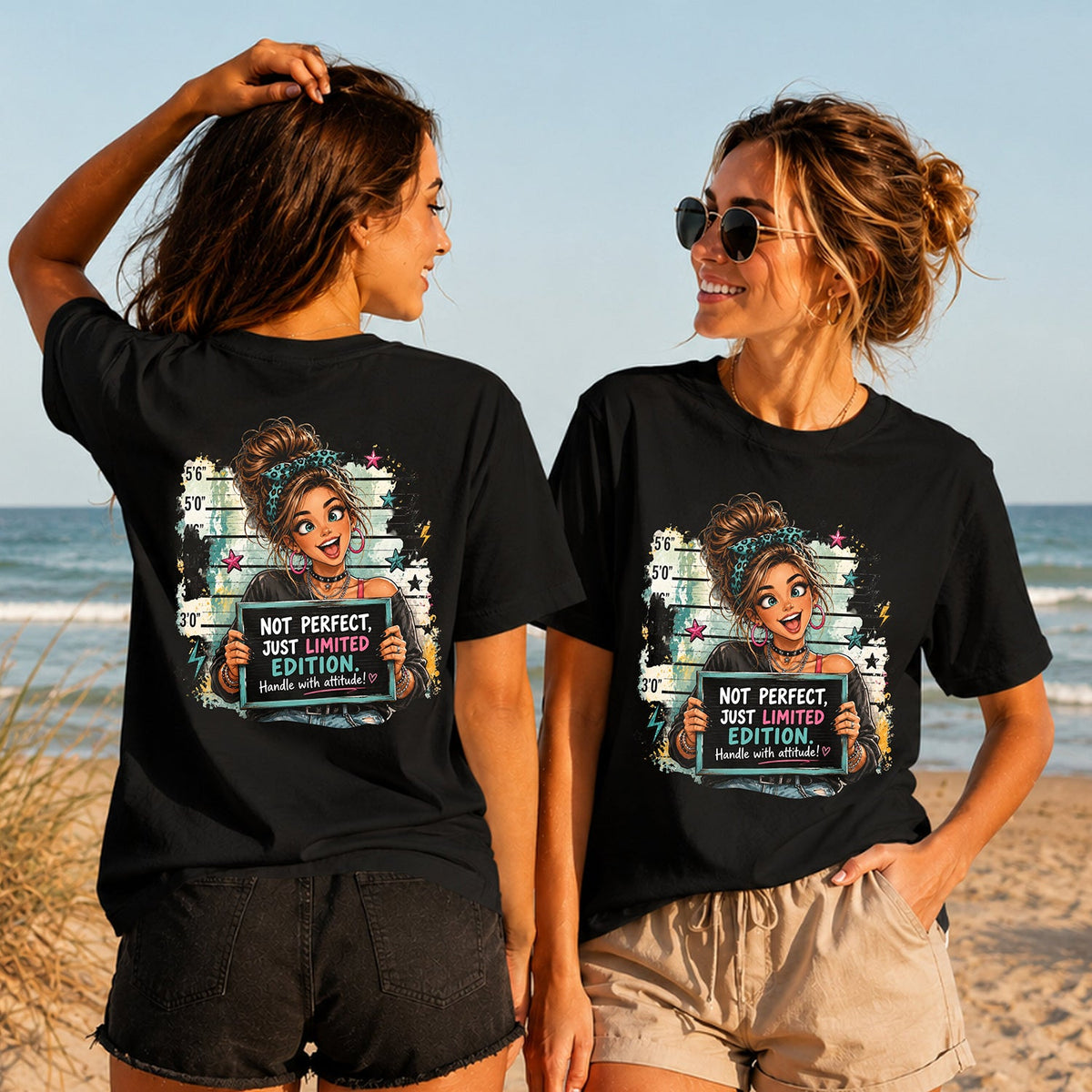 Limited Edition Attitude - Women's T-Shirt in black, showing alternative back and front print placements on the beach