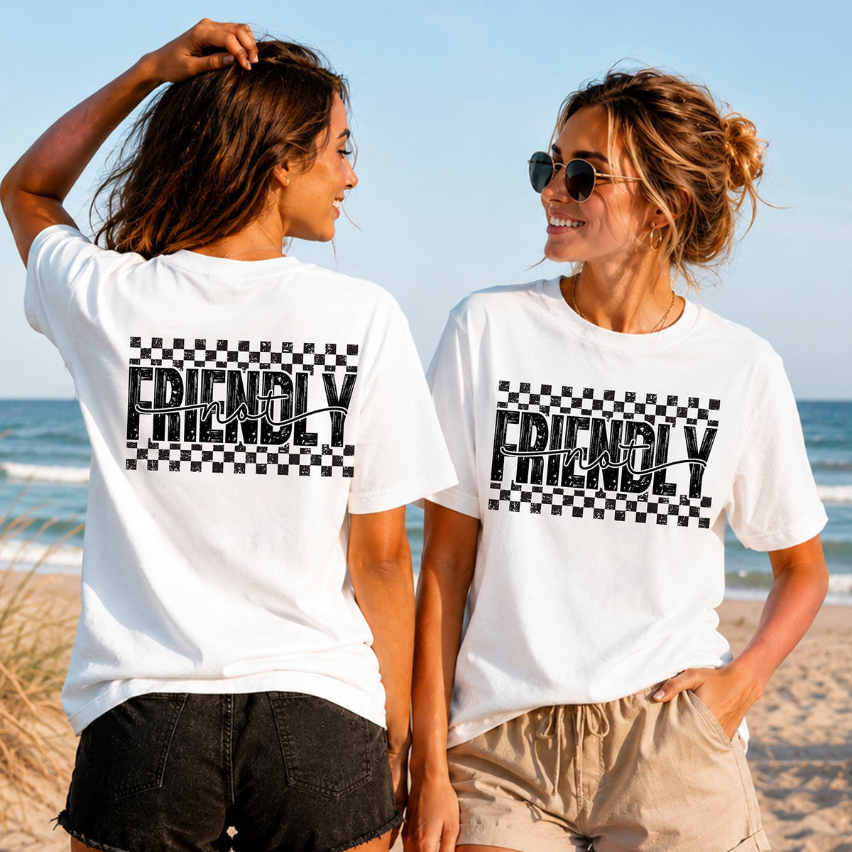 Not Friendly Checkers - Women's T-Shirt in white, showing alternative back and front print placements on the beach