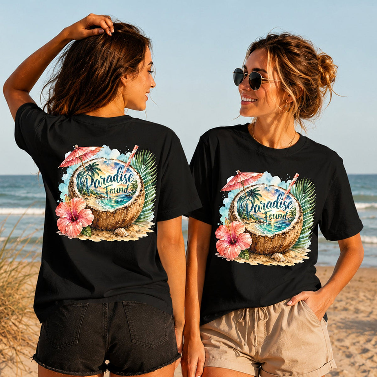 Paradise Found Coconut - Women's T-Shirt in black, showing alternative back and front print placements on the beach