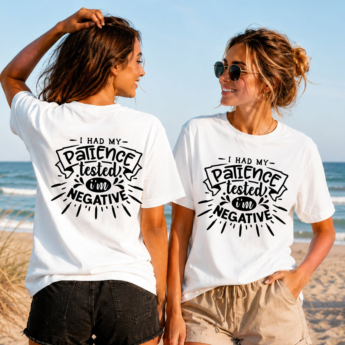 Patience Tested Negative - Black - Women's T-Shirt in white, showing alternative back and front print placements on the beach