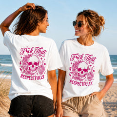 Respectfully Unbothered - Pink Skull - Women's T-Shirt in white, showing alternative back and front print placements on the beach