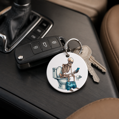 Skeleton On Toilet - Toilet Paper Laptop - Keychain in white