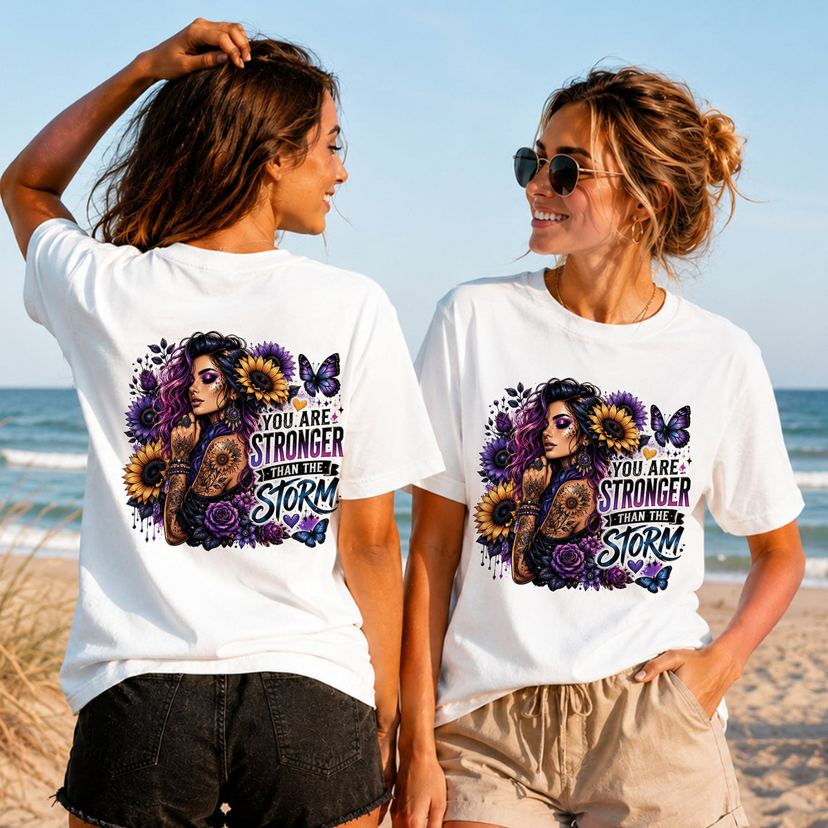 Stronger Than the Storm - Women's T-Shirt in white, showing alternative back and front print placements on the beach