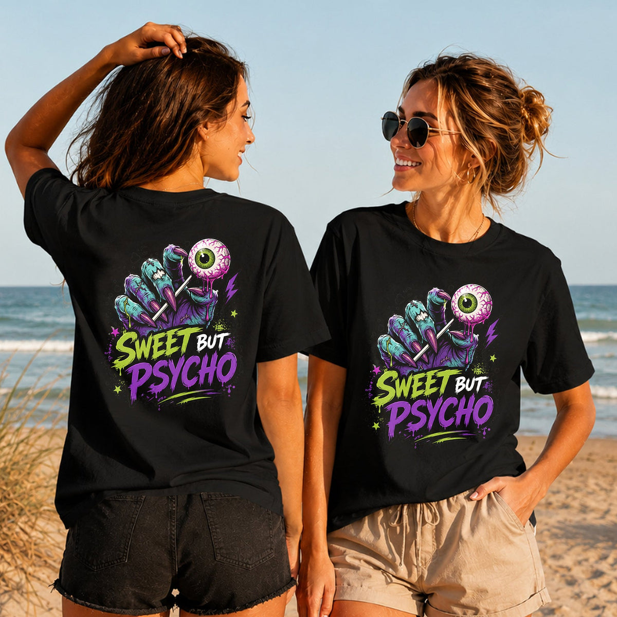 Sweet but Psycho - Eyeball Lollipop - Women's T-Shirt in black, showing alternative back and front print placements on the beach