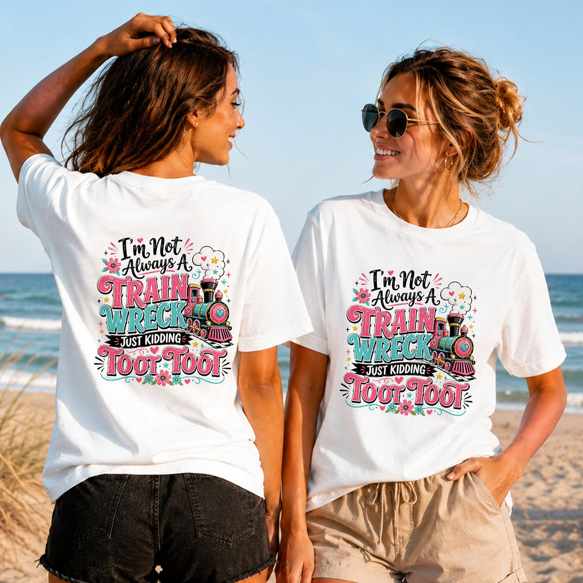 Train Wreck Toot Toot - Women's T-Shirt in white, showing alternative back and front print placements on the beach