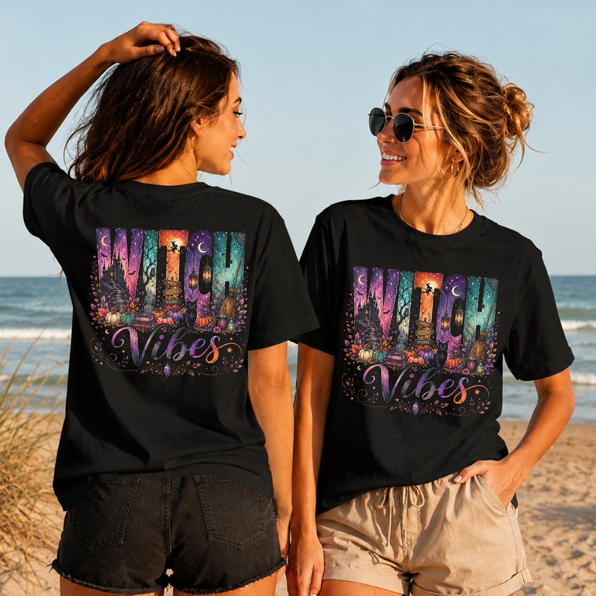Witch Vibes - Women's T-Shirt in black, showing alternative back and front print placements on the beach