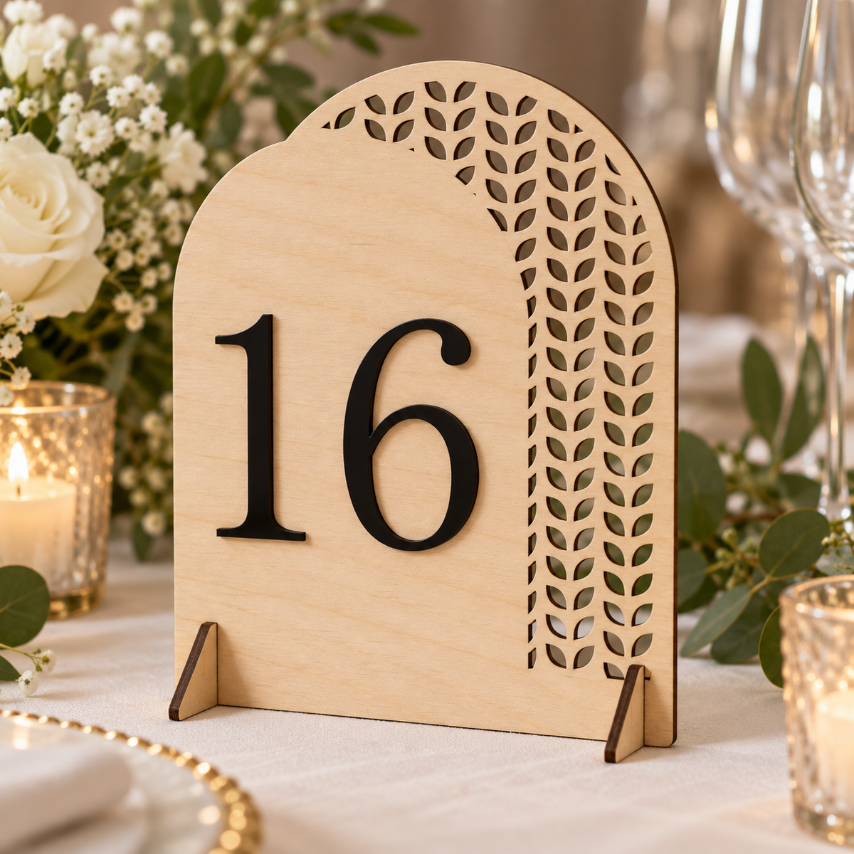 Laurel Cascade Arch Table Number in natural ply with black raised number and triangle feet