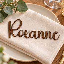 Roxanne in Anytimes font, Walnut Varnished Plywood personalised guest name on an ivory napkin.