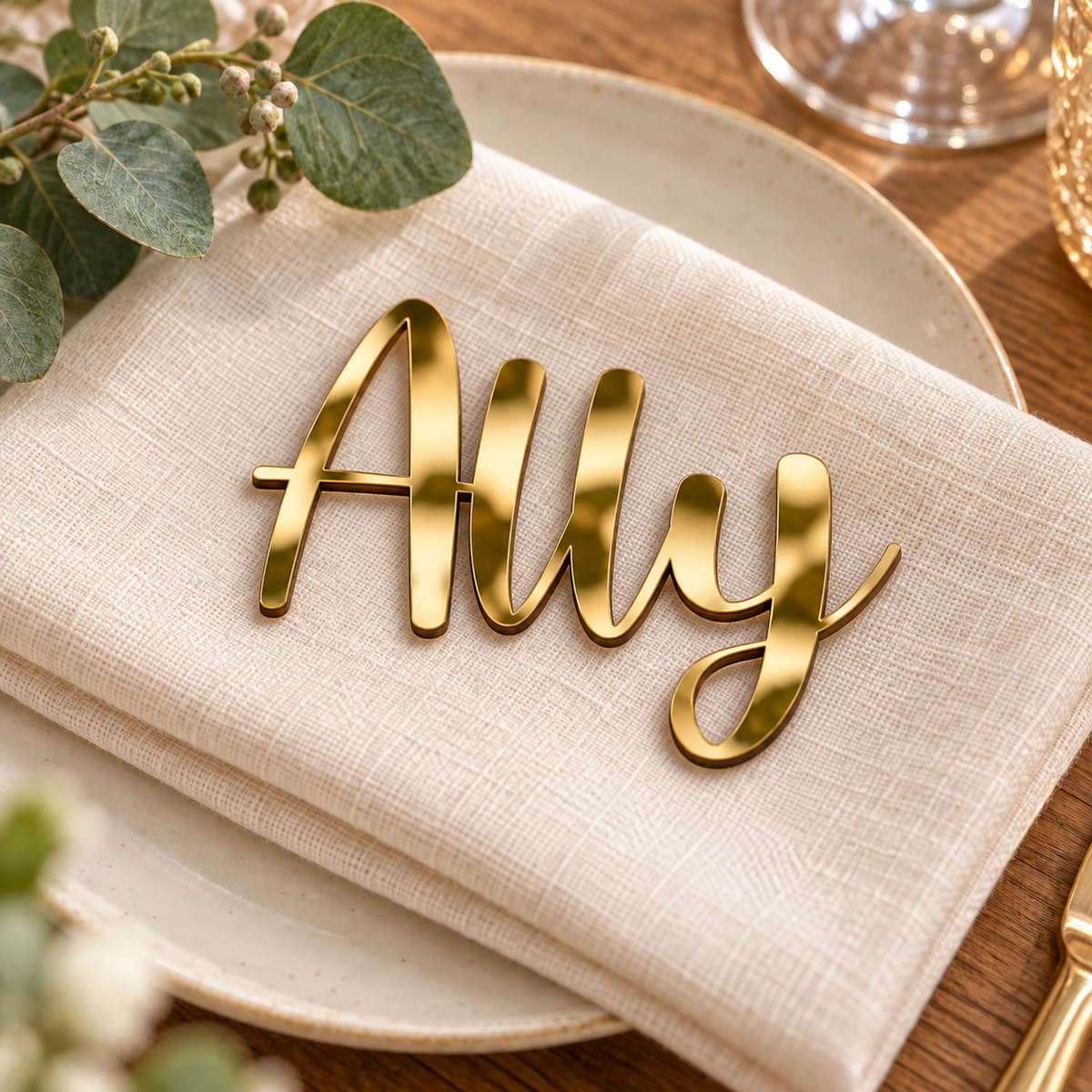 Ally in Awesome Snowflake font, Mirror Gold Acrylic personalised guest name on an ivory napkin.