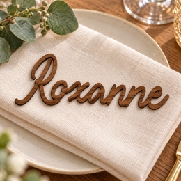 Roxanne in Bentory Authes font, Walnut Varnished Plywood personalised guest name on an ivory napkin.