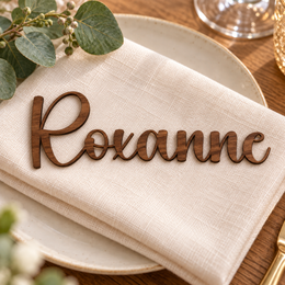 Roxanne in Bubble font, Walnut Varnished Plywood personalised guest name on an ivory napkin.