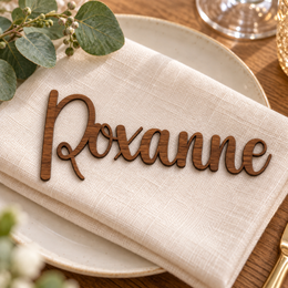 Roxanne in Creativenotes font, Walnut Varnished Plywood personalised guest name on an ivory napkin.
