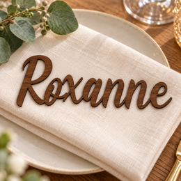 Roxanne in Eaglese Pro font, Walnut Varnished Plywood personalised guest name on an ivory napkin.