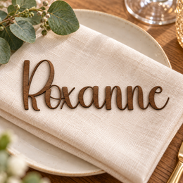 Roxanne in Highbright font, Walnut Varnished Plywood personalised guest name on an ivory napkin.