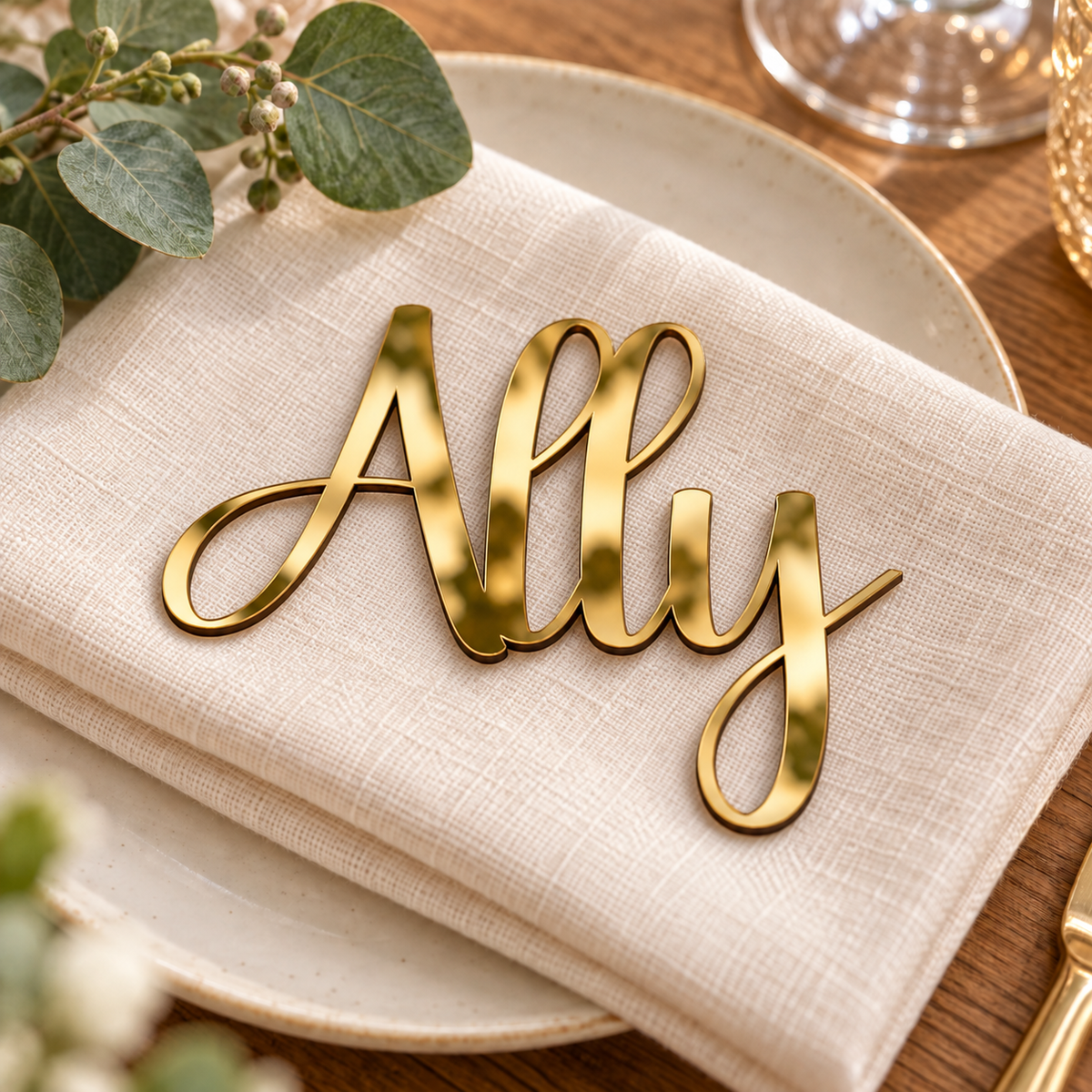 Ally in Ladybug font, Mirror Gold Acrylic personalised guest name on an ivory napkin.