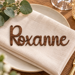 Roxanne in Lucky font, Walnut Varnished Plywood personalised guest name on an ivory napkin.