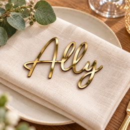 Ally in Monaline font, Mirror Gold Acrylic personalised guest name on an ivory napkin.