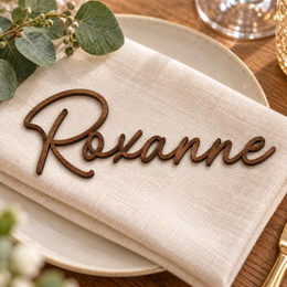 Roxanne in Monaline font, Walnut Varnished Plywood personalised guest name on an ivory napkin.