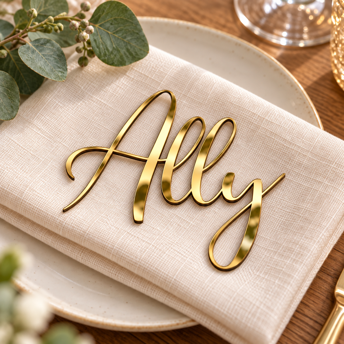 Ally in Potography font, Mirror Gold Acrylic personalised guest name on an ivory napkin.