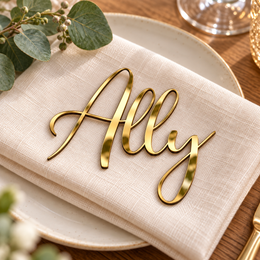 Ally in Potography font, Mirror Gold Acrylic personalised guest name on an ivory napkin.