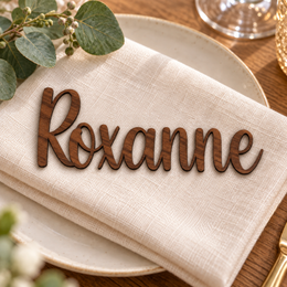 Roxanne in Relaytemore font, Walnut Varnished Plywood personalised guest name on an ivory napkin.